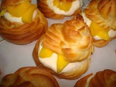 several small pastries with cheese on them