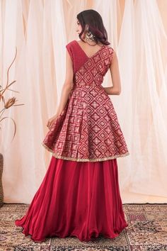 Maroonish red banarasi brocade peplum top with cutdana hand embroidery. Comes with a crepe lehenga. - Aza Fashions Traditional Sleeveless Salwar Kameez For Reception, Traditional Peplum Lehenga For Reception, Traditional Navratri Peplum Dresses, Sleeveless Red Lehenga For Diwali, Designer Peplum Lehenga With Zari Work, Traditional Peplum Lehenga For Navratri, Peplum Anarkali Set For Diwali Reception, Traditional Peplum Choli For Festive Occasions, Sleeveless Raw Silk Traditional Wear For Festive Occasions