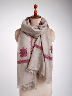 Experience pure luxury with the Handloomed Grey Embroidered Pashmina Wrap, blending traditional craftsmanship with modern sophistication. Crafted from the finest pashmina, this wrap offers an incredibly soft and warm feel, perfect for adding a touch of sophistication to any outfit. The sophisticated grey base provides a versatile canvas, while the exquisite hand-embroidered traditional motifs enhance its classic charm. Each detail reflects meticulous craftsmanship, merging traditional artistry with a modern fashion sensibility. This wrap not only provides exceptional comfort but also elevates your style with a sense of opulence and grace, making it an essential piece for any discerning wardrobe. Dimensions: 100 x 200 cm. Traditional Embroidered Winter Scarves, Beige Embroidered Pashmina Scarf, Embroidered Pashmina Scarves For Winter, Winter Embroidered Pashmina Scarves, Embroidered Pashmina Shawl For Winter, Traditional Pashmina Shawl With Resham Embroidery For Winter, Traditional Handloom Pashmina Shawl For Winter, Handloom Pashmina Shawl For Winter, Wardrobe Dimensions