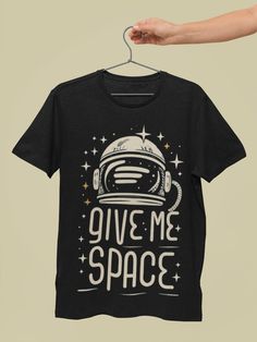 "🌌 \"Give me Space\" T-Shirt - A Bold Statement in the Language of the Cosmos! Premium Quality Fabric: Made from 100% Airlume Combed Cotton, this Bella Canvas 3001 T-shirt offers ultimate comfort and durability. Classic and Versatile: The black and white astronaut design is both timeless and versatile, with additional color options available to suit your style. Unique Space Theme: Ideal for those who love space and value personal boundaries, this shirt features a striking \"Give me Space\" stat Space-themed Cotton T-shirt With Graphic Print, Space-themed Graphic Print Cotton T-shirt, Space-themed Graphic Crew Neck Tops, Space-themed Short Sleeve Top With Graphic Print, Space-themed Graphic Print Short Sleeve Tops, Black Space-themed T-shirt With Letter Print, Black Cotton Space-themed T-shirt, Black Cotton T-shirt With Space Theme, Space-themed Short Sleeve Screen Print Top