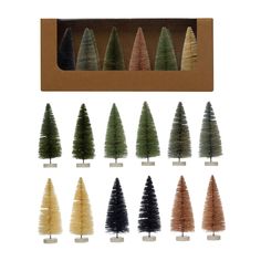 twelve small trees in a cardboard box with different colors and sizes on each tree stand