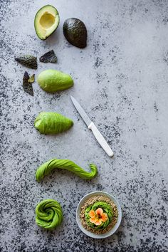 an avocado cut in half and sliced into smaller pieces