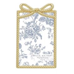 a blue and white floral card with a bow