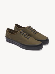 A faithful homage to the 1940s US Navy canvas deck shoe. | Buck Mason Men's Moonstar Canvas PT Deck Shoe in Dark Olive, Size 11 Jefferson White, Buck Mason, Italian Dress, Usa Tee, Canvas Shoe, Leather Outerwear, Deck Shoes, Corduroy Jeans, Swim Shoes