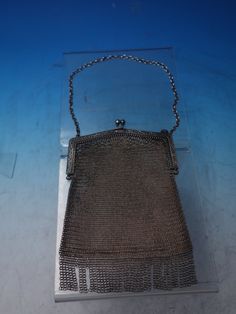 "Beautiful sterling silver mesh purse, circa 1900 (unknown maker, unmarked). This purse measures 5\" x 4 3/4\" and weighs 4.0 troy ounces. It is not monogrammed and is in good vintage condition. Classy! SKU#6172. 100% Satisfaction Guaranteed!" Classic Silver Rectangular Evening Bag, Formal Silver Engraved Bags, Engraved Silver Evening Bag, Victorian Silver Bag For Gift, Silver Antique Rectangular Evening Bag, Antique Silver Rectangular Evening Bag, Flapper Purse 1920s, Silver Antique Evening Bag, Flatware Chest