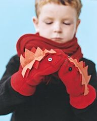 a young boy holding a red stuffed animal