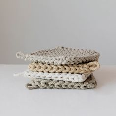 three crocheted dishcloths stacked on top of each other