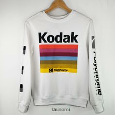 new + preloved.   apparel + sundries.    everyday + life. Kodak Polychrome Graphics Sweatshirt Kodak Polychrome Graphics Sweatshirt Cozy lightweight sweatshirt that features colorful "Kodak Polychrome Graphics" print. Perfect for a photography enthusiast, or anyone looking to add a little color to their wardrobe. Enjoy!  Special Price: $24.95 $34 MSRP SIZE: XS MATERIAL: 60% Cotton; 40% Polyester CONDITION: New with tags. MEASUREMENTS: 36" bust; 25" length. Retro Multicolor Graphic Print Sweatshirt, White Screen Print Band Merch Sweatshirt, Multicolor Cotton Sweatshirt With Logo Print, White Retro Graphic Print Sweatshirt, Casual Multicolor Screen Print Sweatshirt, Casual Multicolor Sweatshirt With Screen Print, Multicolor Long Sleeve Sweatshirt With Screen Print, Multicolor Logo Print Sweatshirt For Streetwear, Retro White Sweatshirt With Screen Print