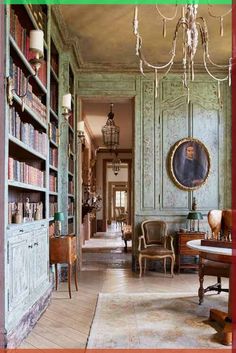 the interior of an old fashioned house with antique furniture and bookshelves in it