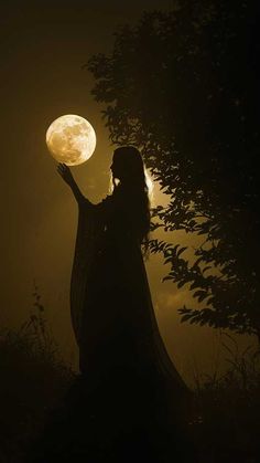 a woman holding the moon in her hand