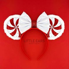 a red minnie mouse ears with white bows