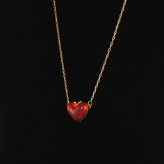 "Vintage Adorable Small Transparent Red Heart Pendant hard to find...from the 1960s. Check out all the multiple colors we have! We were soooo excited when we found these in our vintage vault. Price is for one heart pendant with 16\" vintage chain. This is a fabulous pendant to add to your vintage collection. Collect all colors while they last! This cute little heart measures 5/8\" in height and 7/8\" wide. Also available in red, orange, ivory and Blue. Please feel free to convo with any question Vintage Red Heart-shaped Necklace, Vintage Red Jewelry With Heart Beads, Retro Heart-shaped Necklace Gift, Retro Heart-shaped Necklace For Gift, Retro Heart-shaped Jewelry Gift, Vintage Heart Pendant Necklace With Heart Beads, Vintage Red Jewelry With Heart Charm, Vintage Red Necklace With Heart Charm, Vintage Heart Necklace With Heart Beads