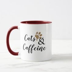 two coffee mugs with cats and caffeine written on the front one is red and white