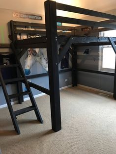 there is a loft bed with ladders in the room