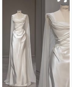 a white wedding dress with long sleeves and a cape on the back, next to a mannequin