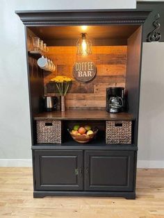 a coffee bar with baskets on the top and shelves below it, in front of a white wall