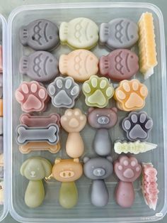 two plastic trays filled with different types of dog and cat soaps on top of each other