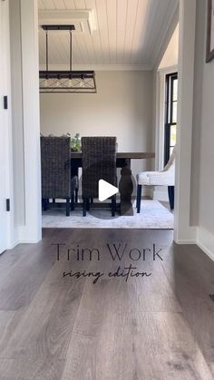 the interior of a house with wood floors and white walls