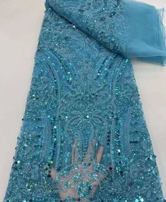 This high quality Fabric is measured in 5 Yards With Embroidered Beading and Sequin. It is soft, very delicate and beautiful. This high Quality Fabric is made with Fashion embroidered rhinestones can be used in making party wedding dresses, skirts, shawls, scarves and other other fashion apparels as you would like. Size : Length : 5 yards (180 inch). Width: 50 inch (Please allow slight deviation for the measurement data ,±1 inch) Material: 100% Polyester, Tulle Lace Fabric, Eco-Friendly embroide Blue Embellished Fitted Embroidered Fabric, Fitted Blue Embellished Embroidered Fabric, Elegant Blue Embroidered Sequin Fabric, Elegant Embroidered Blue Sequin Fabric, Blue Beaded Sequin Fabric, Blue Beaded Fitted Sequin Fabric, Fitted Blue Beaded Sequin Fabric, Elegant Blue Embellished Embroidered Fabric, Blue Embroidered Wedding Fabric With Rhinestones