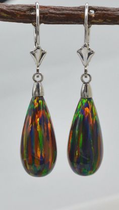 14K Solid White Gold Tear Drop Black Fire Opal Lever back Dangle Earrings fit all periods and are indefectible for diurnal wear to completely parade your style and make you beautiful. Specifications: Metal 14k White Gold (Not Plated) Style Opal Leverback Earrings Finish High Polished Earring Type Dangle (Drop) Gem Black Green Opal Main Stone Shape Tear Drop Main Stone Creation Synthetic Fastening Leverback Stamp 14K Height 37 mm (1.5 mm) Width 8 mm Metal Details Type - 14k solid gold Formal Multicolor Earrings, Multicolor Dangle Earrings For Formal Occasions, Multicolor Teardrop Earrings For Formal Occasions, Black Fire Opal, Black Fire, Makes You Beautiful, Leverback Earrings, Green Opal, Gold Drop Earrings