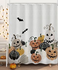 a halloween themed shower curtain with pumpkins and jack - o'- lanternes