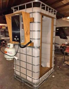 a large white tank sitting inside of a garage