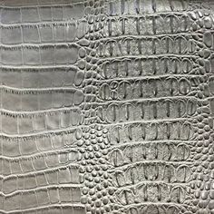 an image of crocodile skin textured in silver