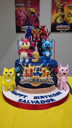 a birthday cake with cartoon characters on it