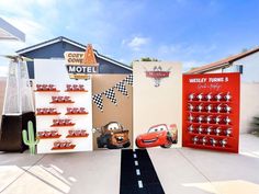 cars and trucks are on display in front of the motel