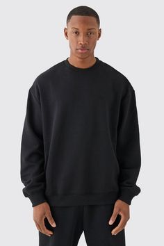 They're like a Swiss army knife for your wardrobe. As well as being a handy go-to for all weathers, the basic crew neck sweatshirt is also the perfect in-betweener for when a coat feels too fancy and a hoodie too casual. With its classic round neck and basic block colours, crew necks can be worth with pretty much anything from sweatpants to jeans and even smart work pants if your workplace has a more laid-back vibe (or it's your bedroom). They're also great for layering between t-shirts and jackets or throwing over your shoulders for creating a day-at-the-races kind of mood. Basically, the perfect all-rounder!Style: Basic SweatshirtDesign: PlainFabric: BrushbackDetail: OversizedNeckline: CrewFit: OversizedSleeve Length: Long Sleeve Plain Sweatshirts, Oversized Crew Neck Sweatshirt, Capsule Closet, Plain Sweatshirt, Basic Sweatshirt, Bear Graphic, Black Sweatshirt, Womens Basic, Black Xs