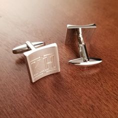 "Silver Crescent Stainless Steel Designer Cuff Links Engraved for Free. We will custom engrave each pair of these Cufflinks with initials or a monogram. Please specify what combination of letters or numbers you would like to appear on your cufflinks. We can engrave initials or monograms on these cuff links. The traditional monogram initials are: First Name Initial - Last Name Initial - Middle Name Initial. The last name in the middle is larger the the first and middle name to the left and right. Classic Engraved Cufflinks, Elegant Silver Jewelry With Engraved Logo, Classic Silver Engraved Cufflinks, Classic Formal Jewelry With Engraved Logo, Silver Cufflinks With Engraving Option For Formal Occasions, Modern Jewelry With Engraved Logo For Gift, Modern Jewelry With Engraved Logo As Gift, Formal Engraved Cufflinks, Classic Personalized Cuff Jewelry