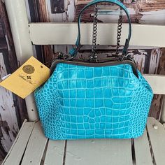 Turquoise Colored Croc Embossed Kiss In Lock Handbag. Antiqued Hardware. Nwt As Seen In Photos. Please Reference All Pictures They're An Important Part Of The Description And Sizing. All Reasonable Offers Welcomed. I Offer Same Day Ship Or Next Try Bundling For Savings Light Blue Travel Bag With Top Carry Handle, Blue Top Handle Box Bag For Travel, Light Blue Satchel With Removable Pouch For Travel, Blue Top Handle Box Bag For Everyday Use, Light Blue Bag With Top Carry Handle For Everyday, Light Blue Everyday Bag With Top Carry Handle, Light Blue Top Handle Shoulder Bag For Travel, Blue Satchel Shoulder Bag With Detachable Strap, Blue Bags With Top Carry Handle For Daily Use