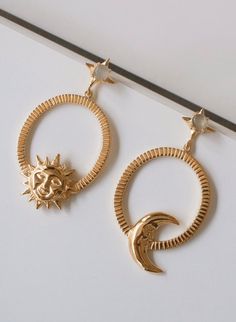 ALLE Sol y Luna Hoops Earrings by Mani Maalai - ALLE Handbags Celestial Sun And Moon Dangle Jewelry, Celestial Style Gold Plated Hoop Earrings, Celestial Gold Plated Moon Earrings, Celestial Gold-plated Single Earring, Celestial Gold Plated Single Earring, Celestial Yellow Gold Brass Earrings, Celestial Moon-shaped Matching Earrings Jewelry, Celestial Single Gold Plated Earring, Gold Symbolic Earrings With Sun And Moon Design