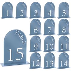 a set of twelve blue tombstones with white numbers