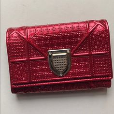 Diorama Elancee Wallet In Red-Tone Metallic Calfskin With "Micro-Cannage" Motif, Jewellery In Red-Tone Metal. Details: - "Micro-Cannage" Motif - Crest-Shaped Clasp And Jewellery In Red-Tone Metal - Titanium-Coloured Lambskin Lining - 8 Card Slots - 2 Flat Pockets - 1 Zipped Pocket - 1 Billfold Compartment - Dimensions: 5.1l X 3.5h In Luxury Red Leather Wallet, Designer Red Rectangular Wallet, Luxury Red Rectangular Wallet, Designer Red Evening Wallet, Power Bracelet, Red Tone, Tote Outfit, Dior Book Tote, Printed Pencil Skirt