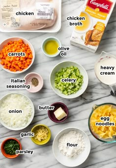 the ingredients to make chicken broth laid out on a marble counter top