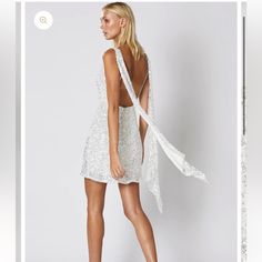 Step Into Cocktail Party Heaven With This Dazzling White Mini Sequin Dress. Perfect For Your Next Birthday, Engagement, Or Any Special Event! New With Tags - **Features:** - Deep V Front - Open Low Back - Adjustable Straps With Draped Sash Detailing - Relaxed Hem This Dream Cocktail Dress Combines Elegance And Allure, Ensuring You Stand Out At Any Gathering. **Questions?** Leave A Comment Below! Glamorous White Cocktail Dress, White Backless Party Dress, White Backless Dress For Party Season, Glamorous White Party Season Dress, Sleeveless White Sequin Dress For Gala, White Cocktail Dress For Party Season, Sequin Mini Dress For Wedding, Backless Sequin Dress For Summer Wedding, White Fitted Sequin Dress For Gala