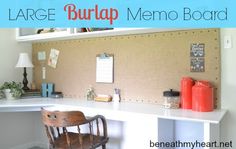 there is a desk with a chair next to it and the words large burlap memo board above it