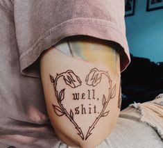 a person with a tattoo on their leg that says, we'll shii