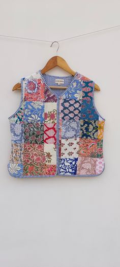 a patchwork vest hanging on a clothes line