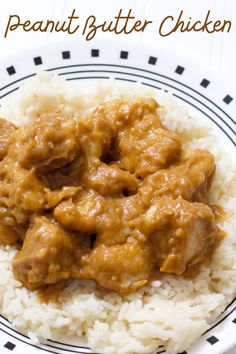 a white plate topped with rice and meat covered in gravy on top of it