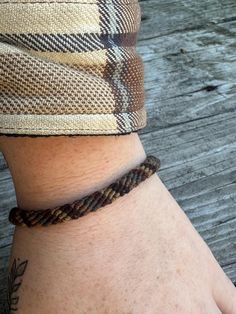 This listing is for a single pre-made bracelet. Earth toned browns. Braided together in a striped pattern with high quality cotton embroidery thread.  Size: Length: 7-8" Width: 1/8"- 1/4" Friendship Bracelets Earth Tones, Casual Brown Bracelet Jewelry, Brown Hand Wrapped Braided Bracelets For Friendship, Handmade Brown Braided Friendship Bracelets, Handmade Brown Braided Bracelets For Friendship, Casual Hand Wrapped Brown Jewelry, Casual Brown Hand Wrapped Jewelry, Hand Wrapped Brown Braided Bracelets For Friendship, Casual Brown Bracelets For Everyday Wear