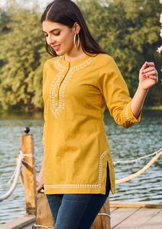 Tops and Tees/ Womens Short Kurtis/ Dresses For Women/Indian Wedding Dress/Pakistani Suit/ Kurta Palazzo Set / Kurtis for Women/ Gift for Women / T-shirt For women/ Summer Wear Product Details: Mustard Yellow Embroidery Cotton Tunic Mandarin Collar 3/4 sleeves Regular Wear Easy to carry In Summer Skin friendly Material and care: Cotton Hand wash Package Contents: Only one piece Kurta  PLEASE SEE THE SIZE CHART BEFORE PLACING THE ORDER WE ALSO ACCEPT CUSTOMISED ORDER AS PER CUSTOMER REQUESTS. For Short Kurta Tops For Women, Yellow Shirts Women, Short Kurtas Women, Short Tunics For Women, Modern Tops For Women, Yellow Short Kurti, Short Kurti Look, Embroidery Shirts For Women, Yellow Tops For Women