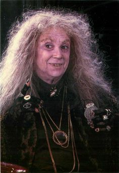 an old woman with long hair and jewelry