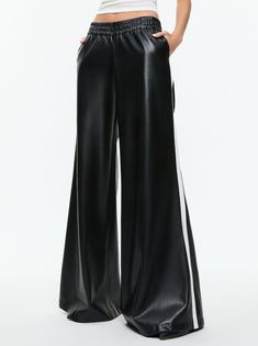 Our best-selling wide leg pant is now crafted in soft vegan leather that looks just like the real thing. Elba includes a low rise, full length leg, elastic waistband (you're welcome) and racing stripe up the side. Such a cool pant. Youre Welcome, Boss' Day, Low Rise Pants, Racer Jacket, Leather Pant, Long Tank, Racing Stripes, Wide Leg Pant, Elba