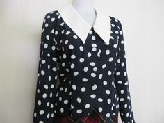 "Liz Claiborne Peplum Blouse ~Sassy~ Polka Dot Blouse ~This is a WOW~ Beautifully tailored and fitted Poly crepe A bit dress up! Button front Peplum waist Shoulder pads have been removed Small 4 Petite Bust 38\" Waist 30\" Hip 40\" Shoulder 16\" Length 19\" Excellent condition Looks unworn! https://www.etsy.com/shop/BelindasStyleShop" Fitted Long Sleeve Polka Dot Blouse, Classic Fitted Polka Dot Blouse, Chic Fitted Blouse With Peter Pan Collar, Vintage Tops With Peter Pan Collar For Office, Classic Fitted Polka Dot Tops, Classic Fitted Blouse With Peter Pan Collar, Retro Fitted Blouse With Peter Pan Collar, Fitted Retro Blouse With Peter Pan Collar, Retro Fitted Blouse With Collar