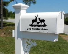 a white mailbox with two deer on it and the number 799 hunters lane