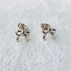 18K Gold or 18K White Gold Plated Bow-Knot Charm Stud Earrings These earrings embody minimalist and clean-cut design, with a touch of elegance. - Materails: Copper, 18K gold and 18K white gold - Dimension: 0.6 x 0.7 cm Wedding Jewelry Earrings, Cut Design, Wedding Earrings, Wedding Jewelry, 18k Gold, Etsy Earrings, Gold Plate, Plating, Jewelry Earrings