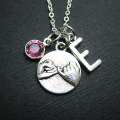 "BFF Pinky Promise necklace with personalized initial charm and your choice of birthstone crystal. Create a meaningful gift or wear as your own personalized necklace. This promise necklace comes gift wrapped in gift bag or gift box. ♥ Pinky promise charm measures approx. 15 x 18 mm ♥ 4mm Swarovski crystal birthstone ♥ 18\" Silver-plated cable necklace . . . . . . . . . . . . . . . . . . . . . . . . HOW TO ORDER . . . . . . . . . . . . . . . . . . . . . . . . . 1) Select a Swarovski crystal birthstone 2) Select a letter and initial design ♥ Let me know if you need a different necklace length or chain design ♥ Leave a message in the 'Note to LaVieIllustree' box: eg. 16\", 17\", 18\", 24\" . . . . . . . . . . . . . . . . . . . . . . . . . . . . . . . . . . . . . . . . . . . . . . . . . . . . Pinkie Promise Necklace, Silver Initial Pendant Jewelry For Best Friend, Silver Hand Stamped Jewelry For Friendship, Customizable Sterling Silver Charm Necklace For Best Friend, Sterling Silver Round Charm Necklace For Best Friend, Sterling Silver Round Charm Necklaces For Best Friend, Silver Birthstone Jewelry For Friendship, Mother's Day Best Friend Gift Initial Pendant Charm Necklace, Valentine's Day Birthstone Necklace For Best Friend