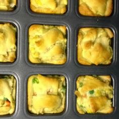 several trays filled with different types of food in muffin tins on top of a table